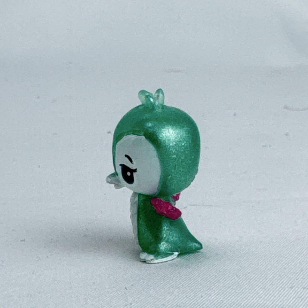 Mattel Barbie Dreamtopia miniature green shimmer penguin pet figure with pink glitter wings.