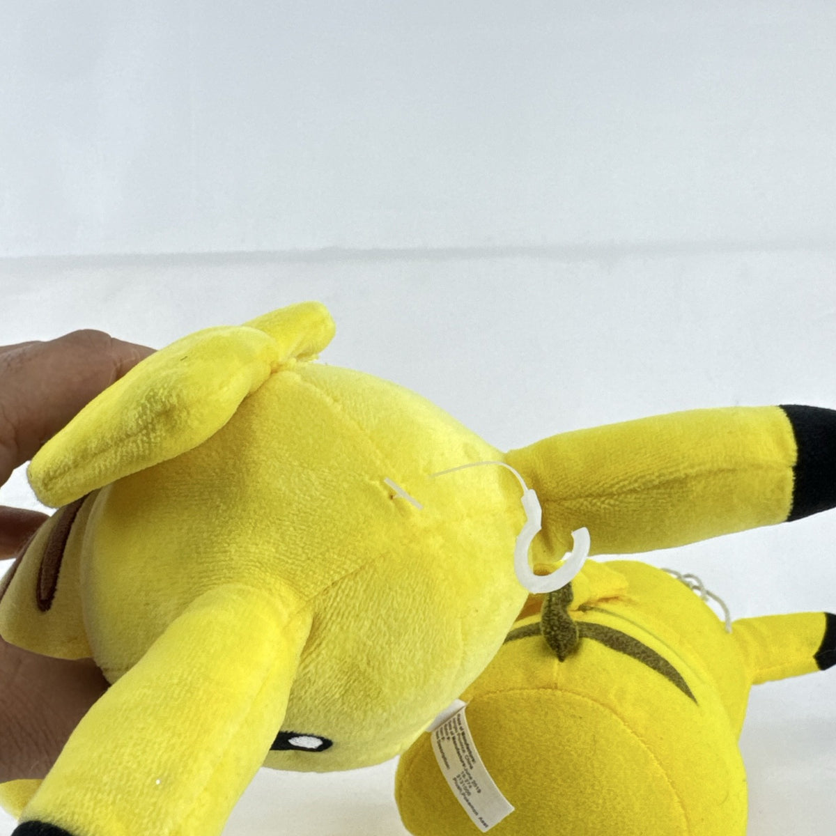 Pair of two yellow Pokémon Pikachu plush stuffed animals in 7-inch and 8.5-inch sizes.
