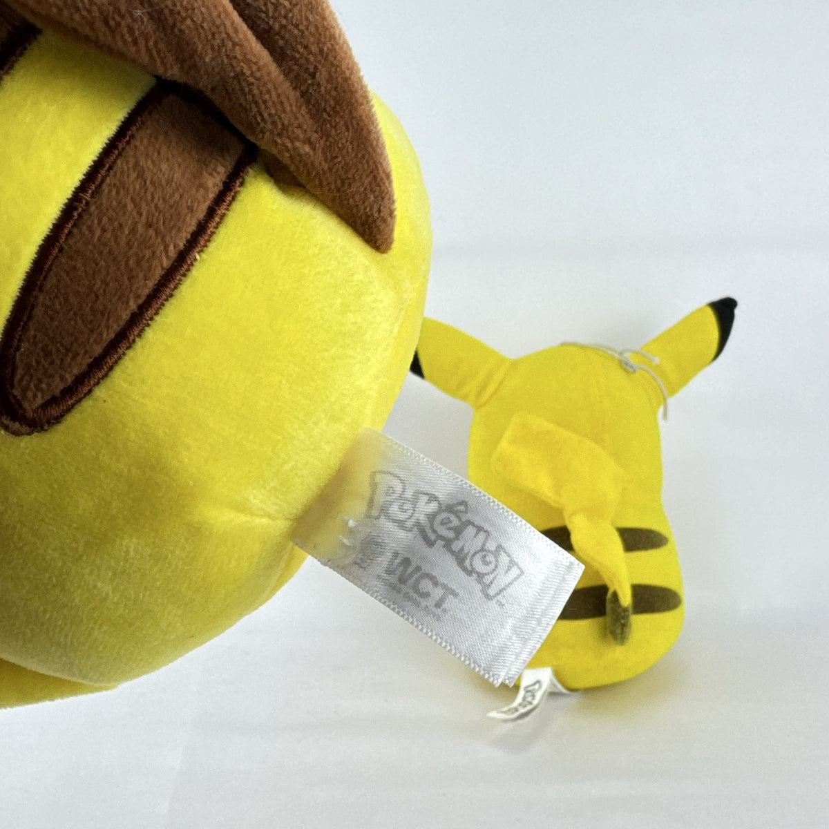 Pair of two yellow Pokémon Pikachu plush stuffed animals in 7-inch and 8.5-inch sizes.