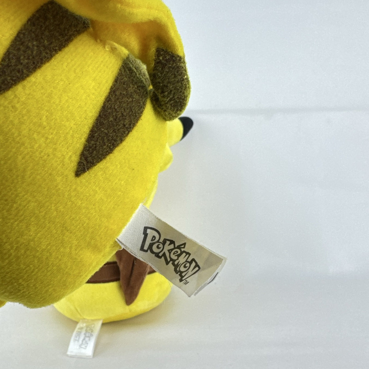 Pair of two yellow Pokémon Pikachu plush stuffed animals in 7-inch and 8.5-inch sizes.