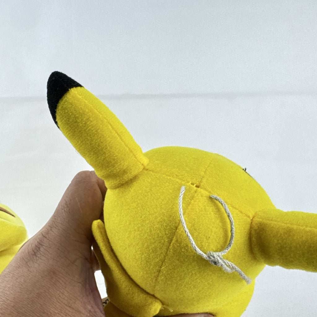 Pair of two yellow Pokémon Pikachu plush stuffed animals in 7-inch and 8.5-inch sizes.