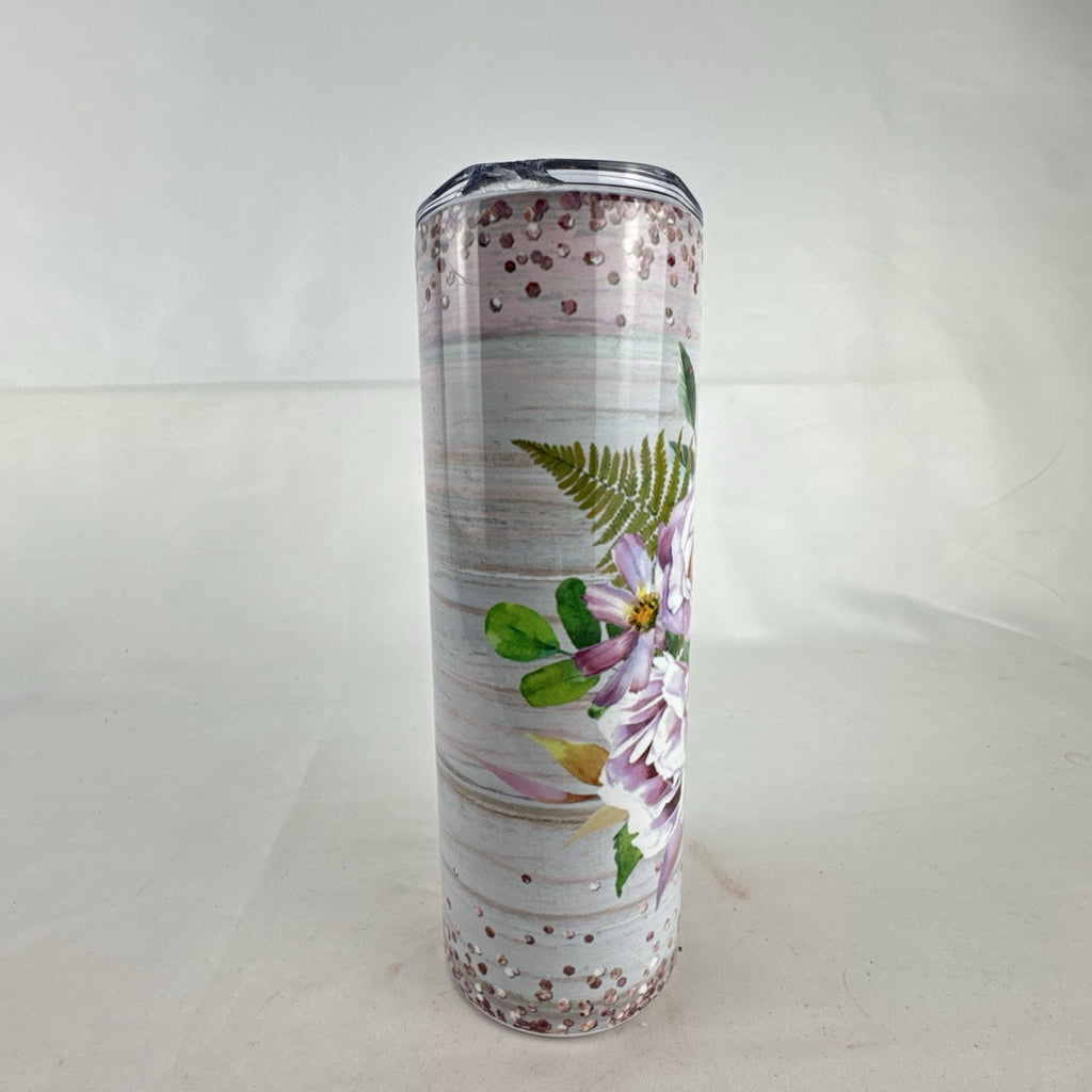 20 oz stainless steel skinny tumbler featuring a patriotic American flag cowboy boot and floral design.