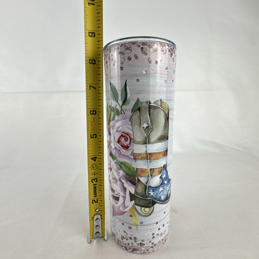 20 oz stainless steel skinny tumbler featuring a patriotic American flag cowboy boot and floral design.