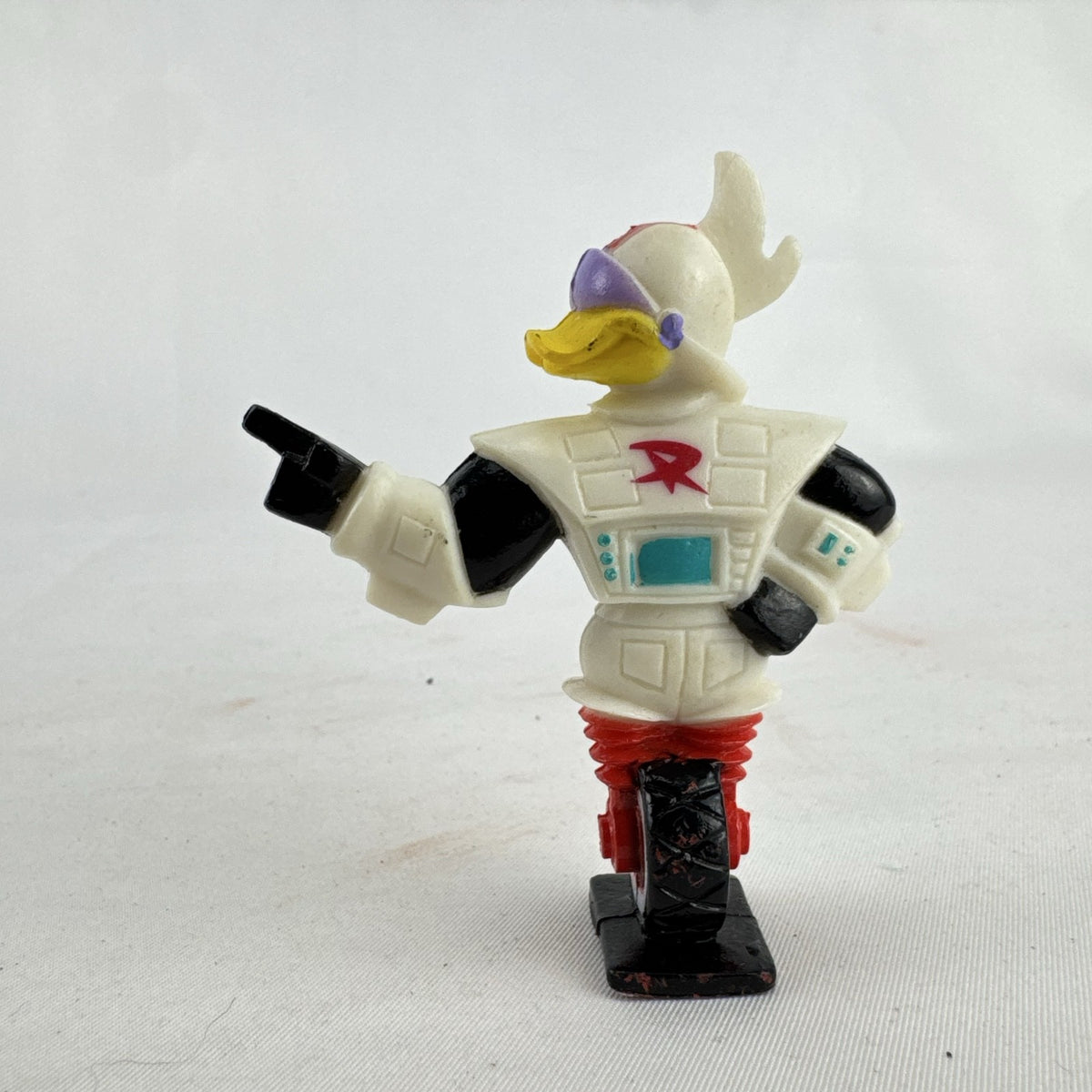 Vintage 1991 Disney and Kellogg's molded plastic Gizmoduck cereal toy figure on unicycle wheel