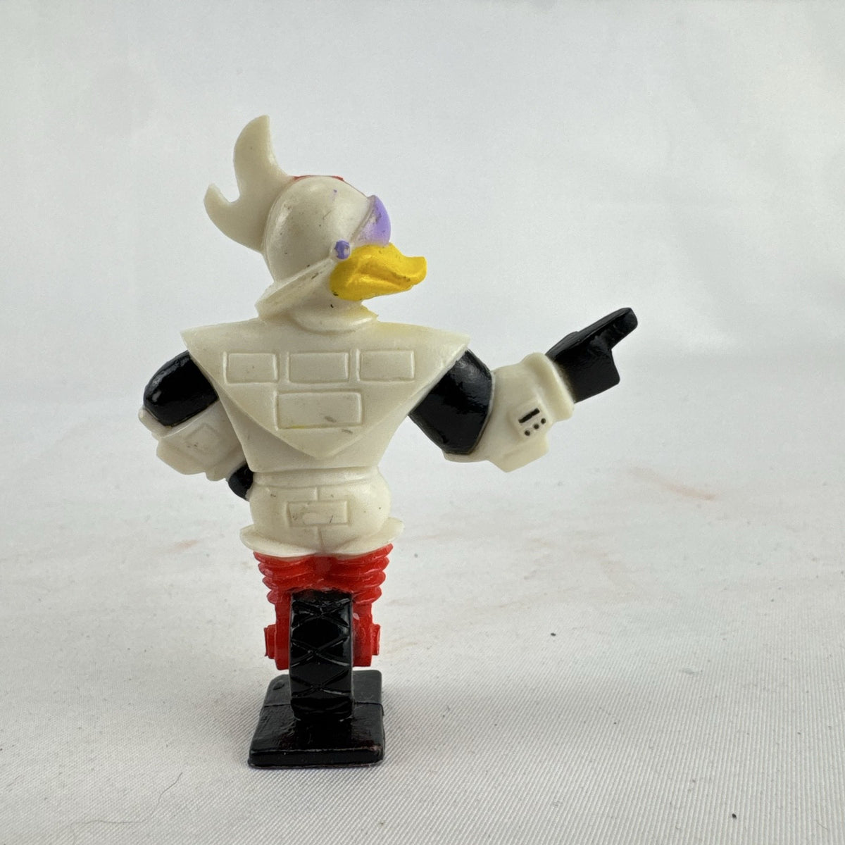 Vintage 1991 Disney and Kellogg's molded plastic Gizmoduck cereal toy figure on unicycle wheel