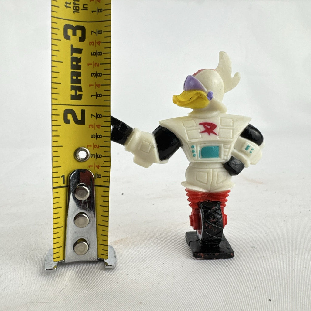 Vintage 1991 Disney and Kellogg's molded plastic Gizmoduck cereal toy figure on unicycle wheel
