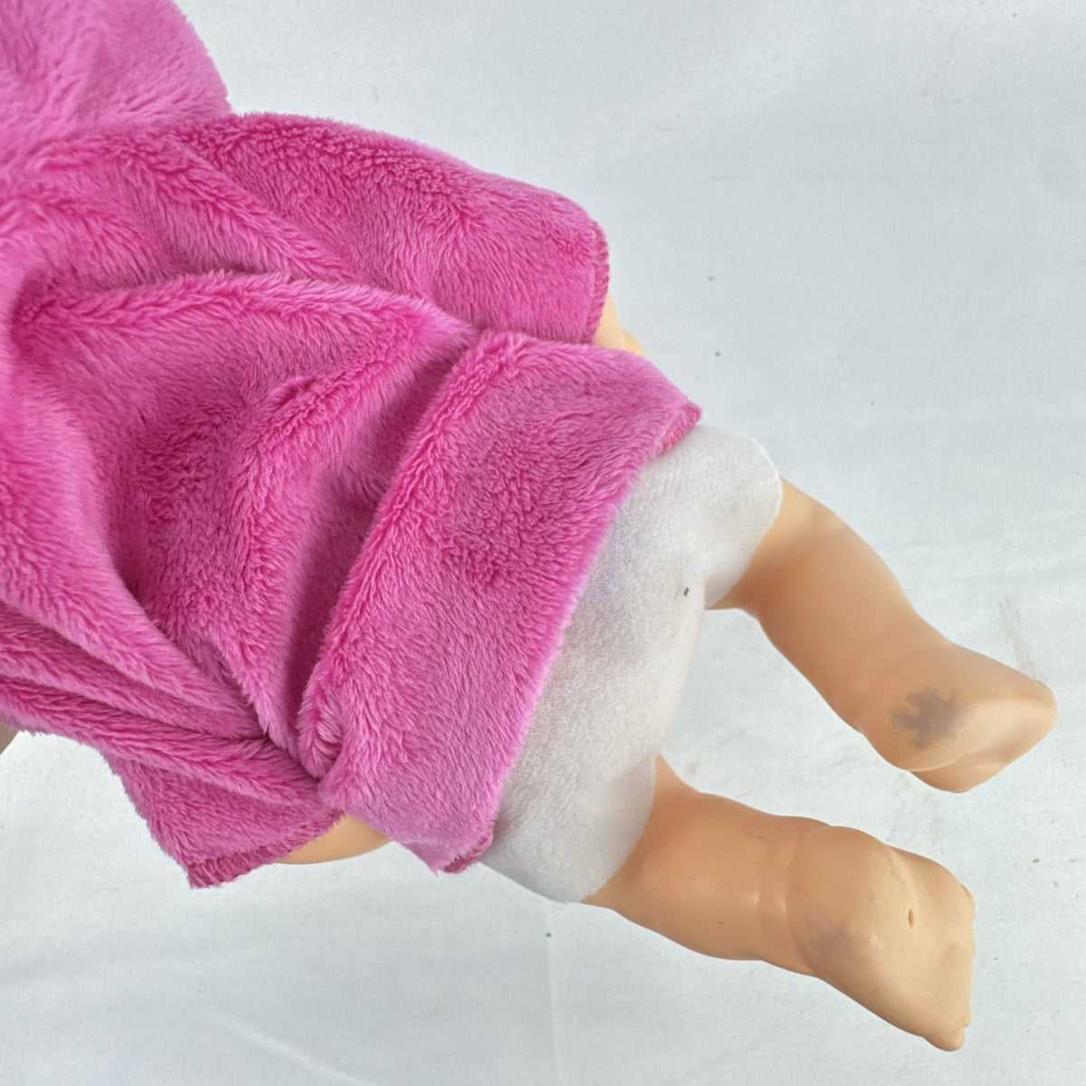 Cabbage Patch Kids 9-inch vinyl baby doll wearing a hooded pink unicorn robe with silver horn