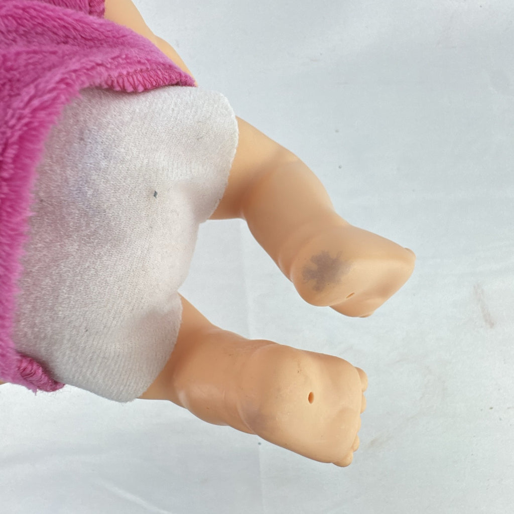Cabbage Patch Kids 9-inch vinyl baby doll wearing a hooded pink unicorn robe with silver horn