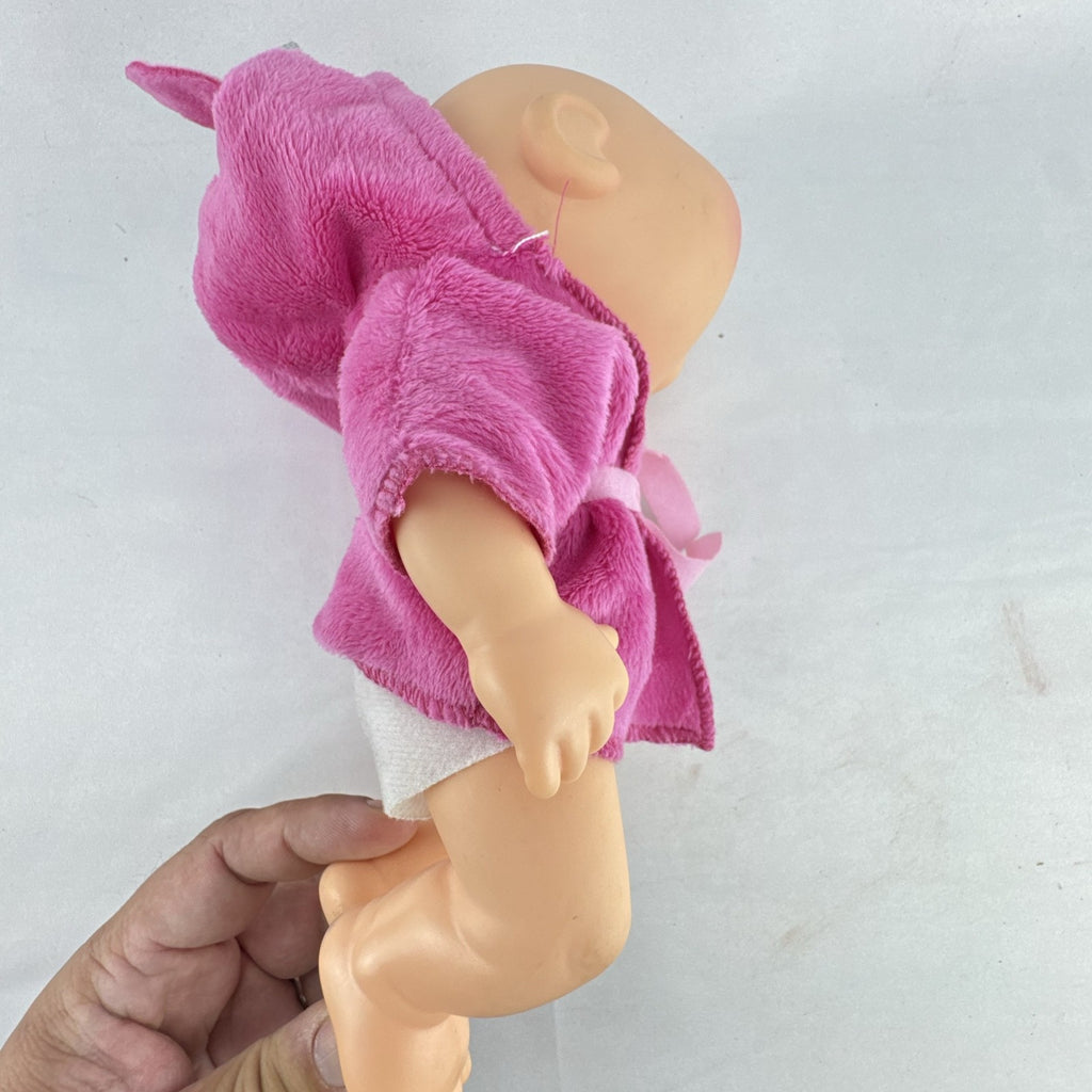 Cabbage Patch Kids 9-inch vinyl baby doll wearing a hooded pink unicorn robe with silver horn