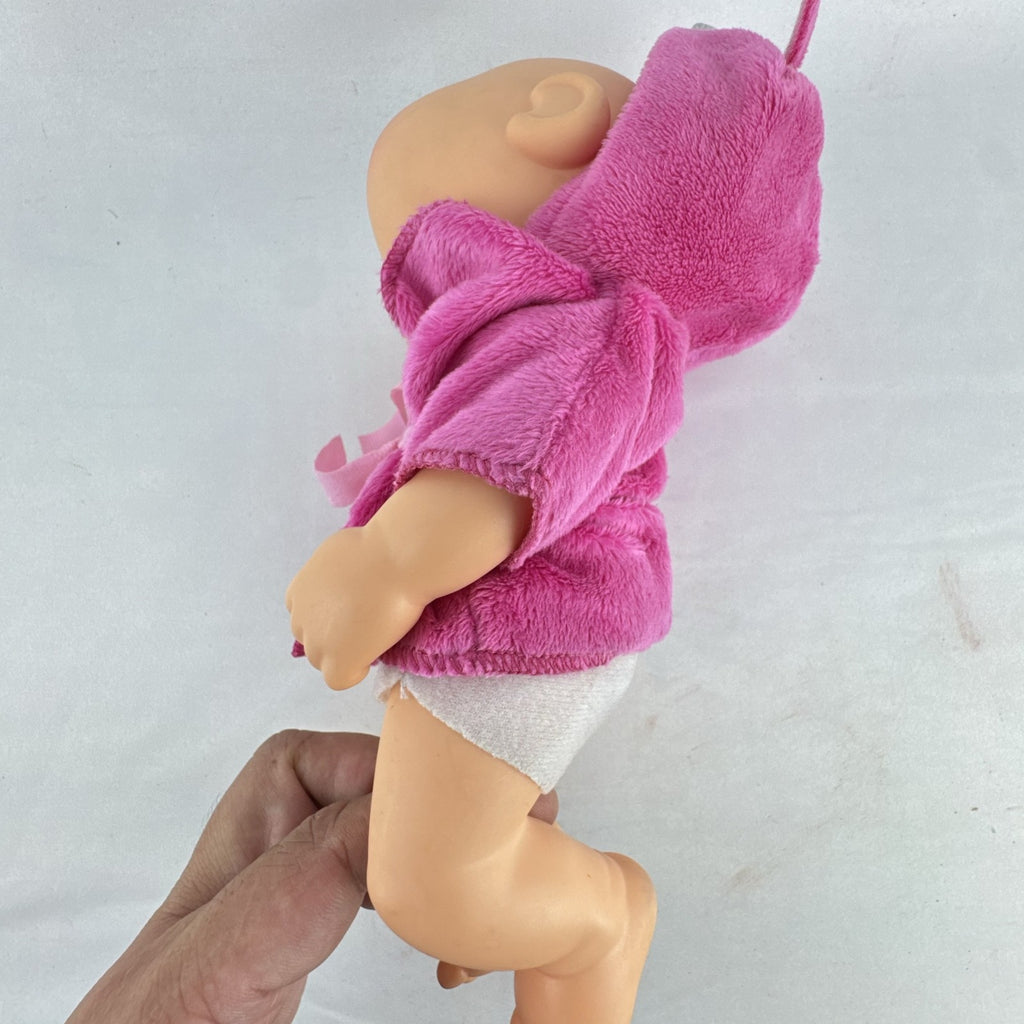 Cabbage Patch Kids 9-inch vinyl baby doll wearing a hooded pink unicorn robe with silver horn