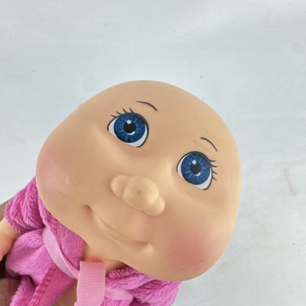 Cabbage Patch Kids 9-inch vinyl baby doll wearing a hooded pink unicorn robe with silver horn