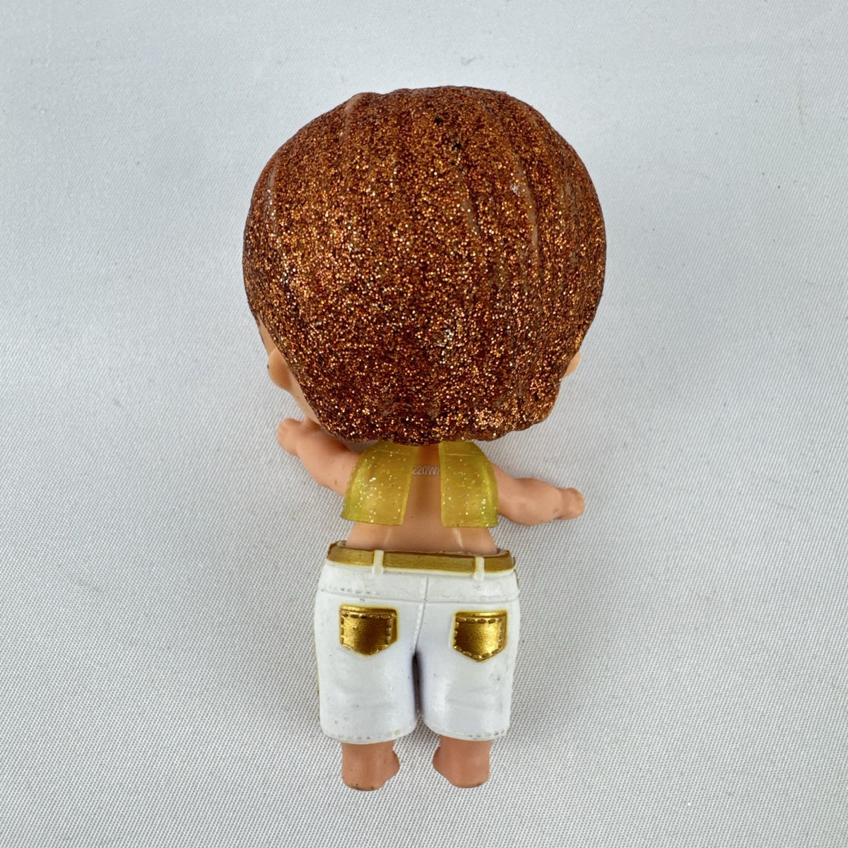 MGA L.O.L. Surprise! Boys His Royal High-Ness doll with glitter hair and gold outfit