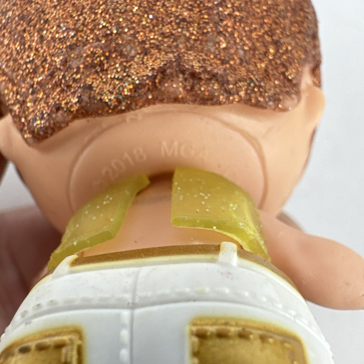 MGA L.O.L. Surprise! Boys His Royal High-Ness doll with glitter hair and gold outfit