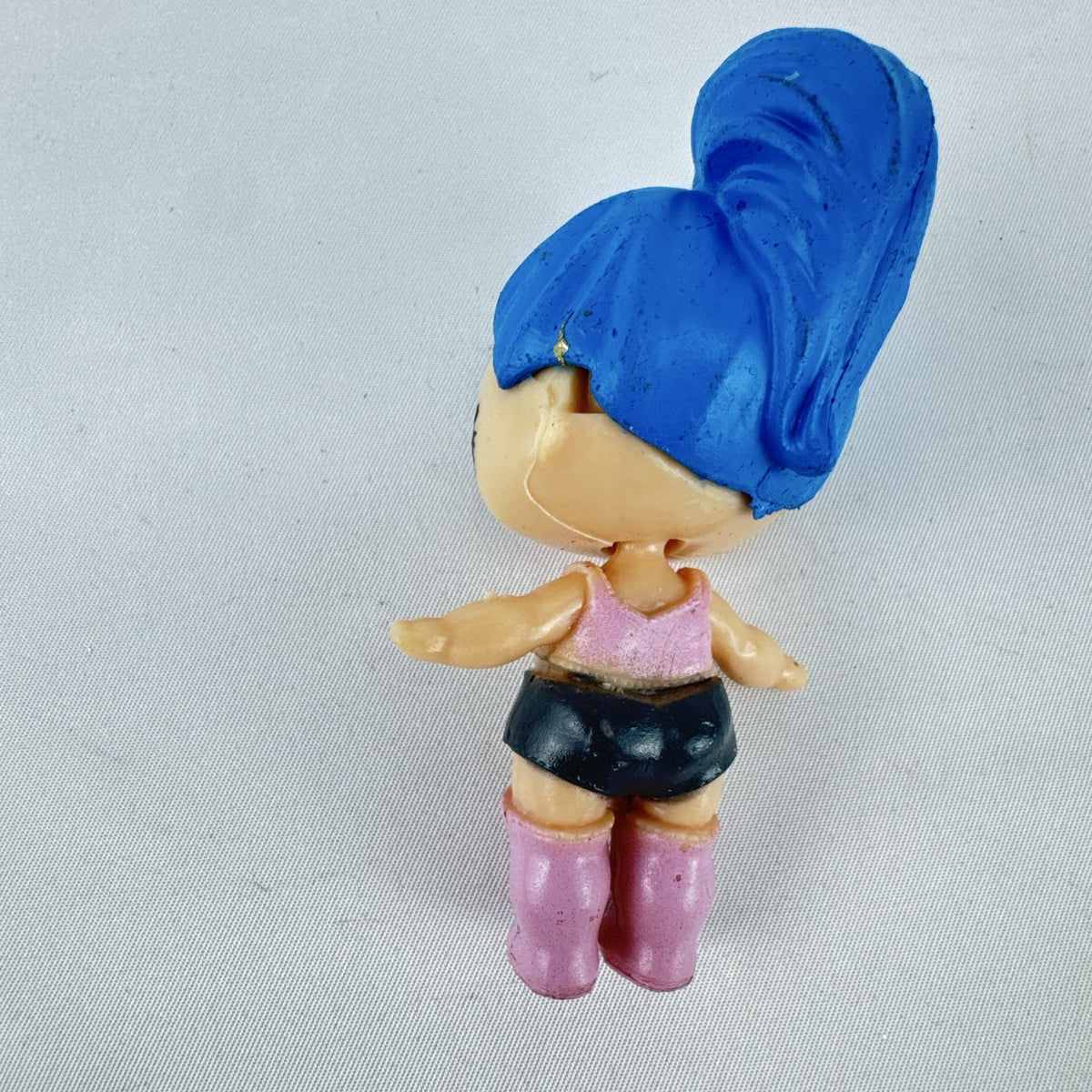 Front view of 3-inch L.O.L. Surprise style Center Stage mini doll figure with blue sculpted hair and pink boots