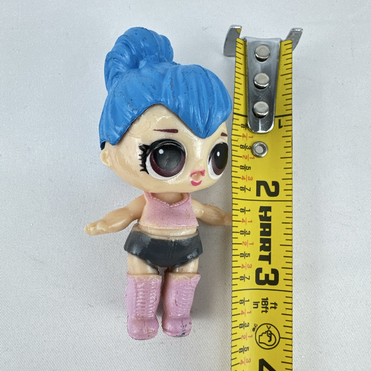 Front view of 3-inch L.O.L. Surprise style Center Stage mini doll figure with blue sculpted hair and pink boots
