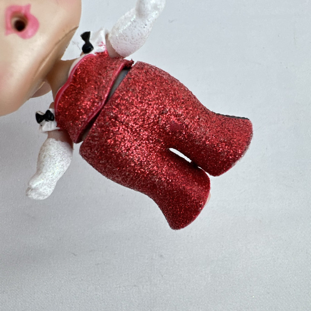 MGA L.O.L. Surprise Holiday Glitter 3-inch mini doll with white glitter hair and red sparkly outfit