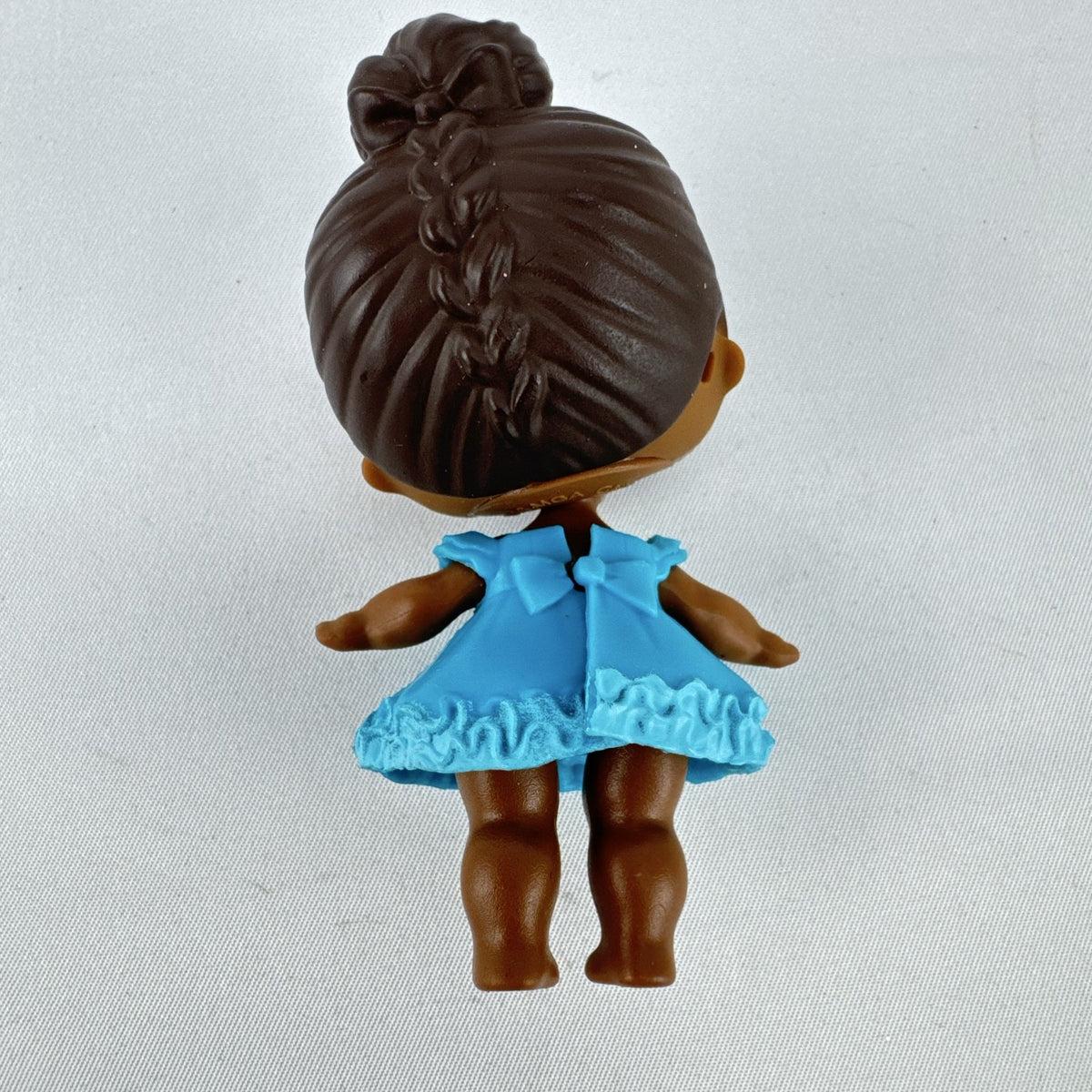 MGA L.O.L. Surprise Series 1 Royal High-Ney 3-inch doll in blue ruffled dress