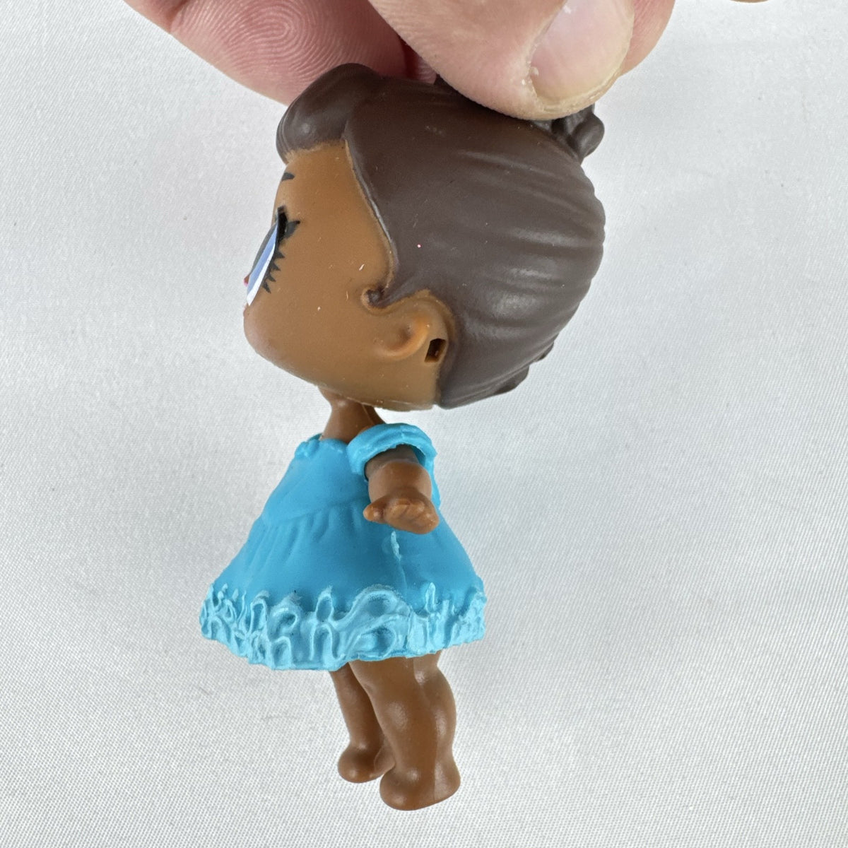 MGA L.O.L. Surprise Series 1 Royal High-Ney 3-inch doll in blue ruffled dress