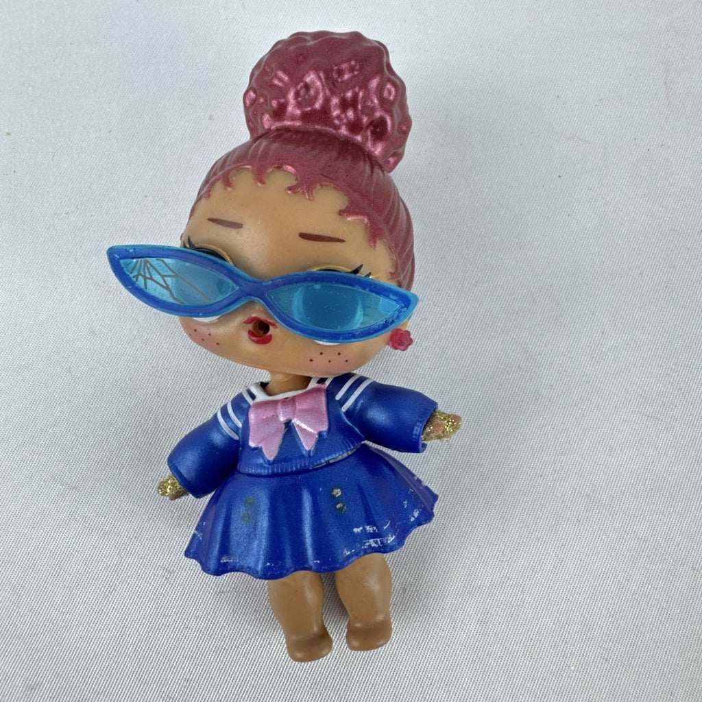 MGA Entertainment L.O.L. Surprise Jet Set Q.T. vinyl doll wearing blue sailor dress and cat-eye sunglasses