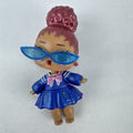 MGA Entertainment L.O.L. Surprise Jet Set Q.T. vinyl doll wearing blue sailor dress and cat-eye sunglasses