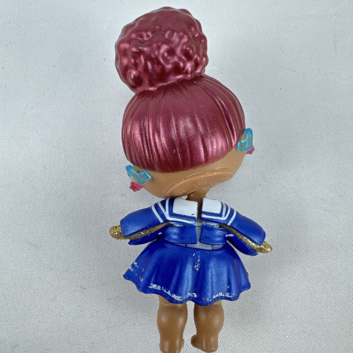 MGA Entertainment L.O.L. Surprise Jet Set Q.T. vinyl doll wearing blue sailor dress and cat-eye sunglasses