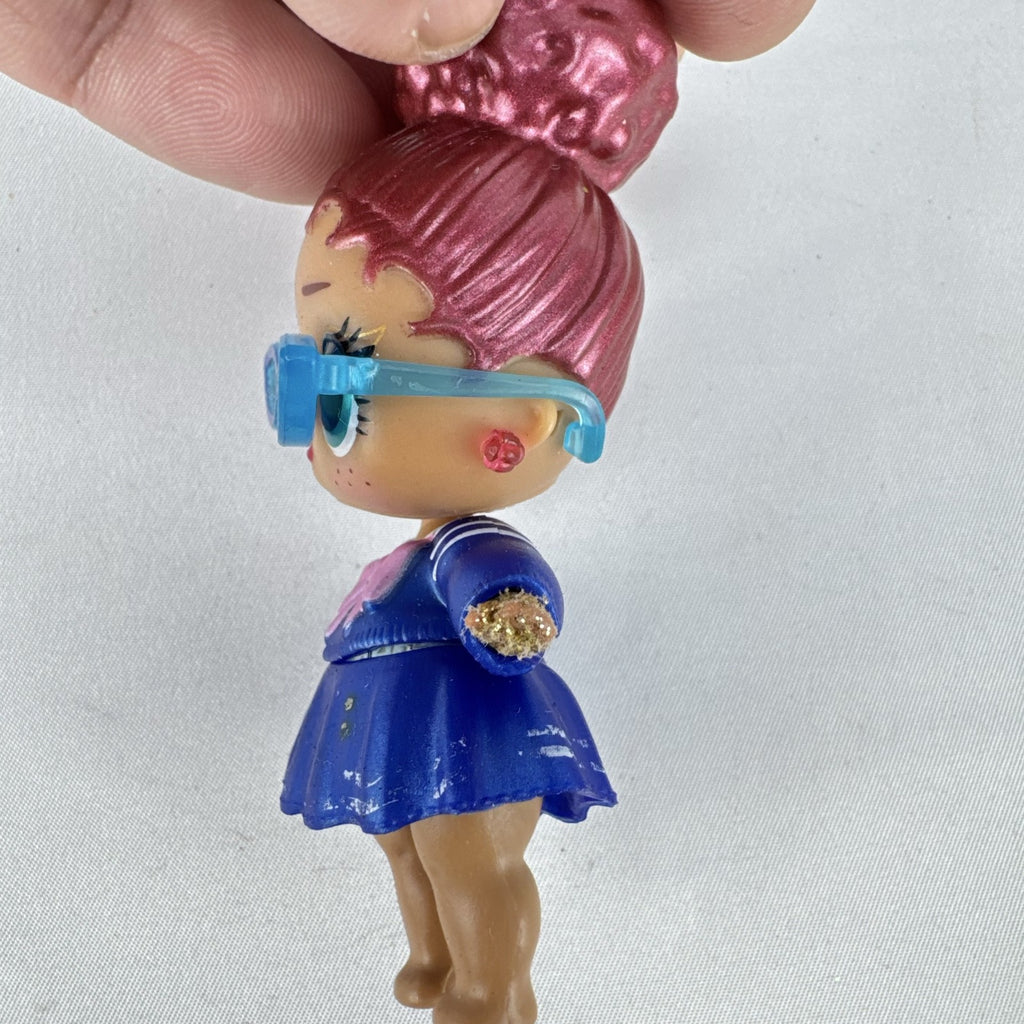 MGA Entertainment L.O.L. Surprise Jet Set Q.T. vinyl doll wearing blue sailor dress and cat-eye sunglasses