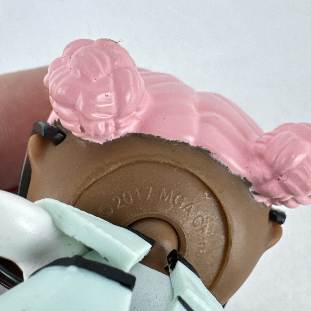 MGA L.O.L. Surprise Jet Set Q.T. 3-inch doll wearing a mint green trench coat, red sunglasses, and pink boots