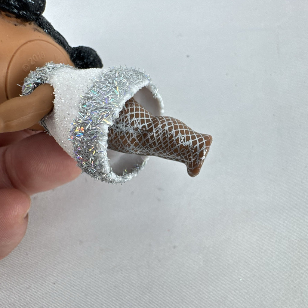 MGA L.O.L. Surprise 3-inch doll with black glitter hair buns and silver tinsel dress