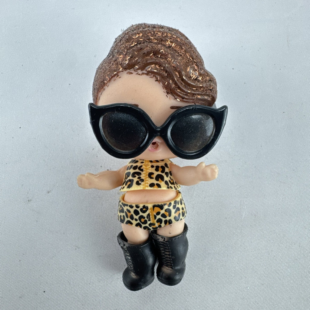MGA L.O.L. Surprise! 3-inch doll wearing leopard print outfit, cat-eye sunglasses, and boots with brown glitter hair