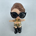 MGA L.O.L. Surprise! 3-inch doll wearing leopard print outfit, cat-eye sunglasses, and boots with brown glitter hair