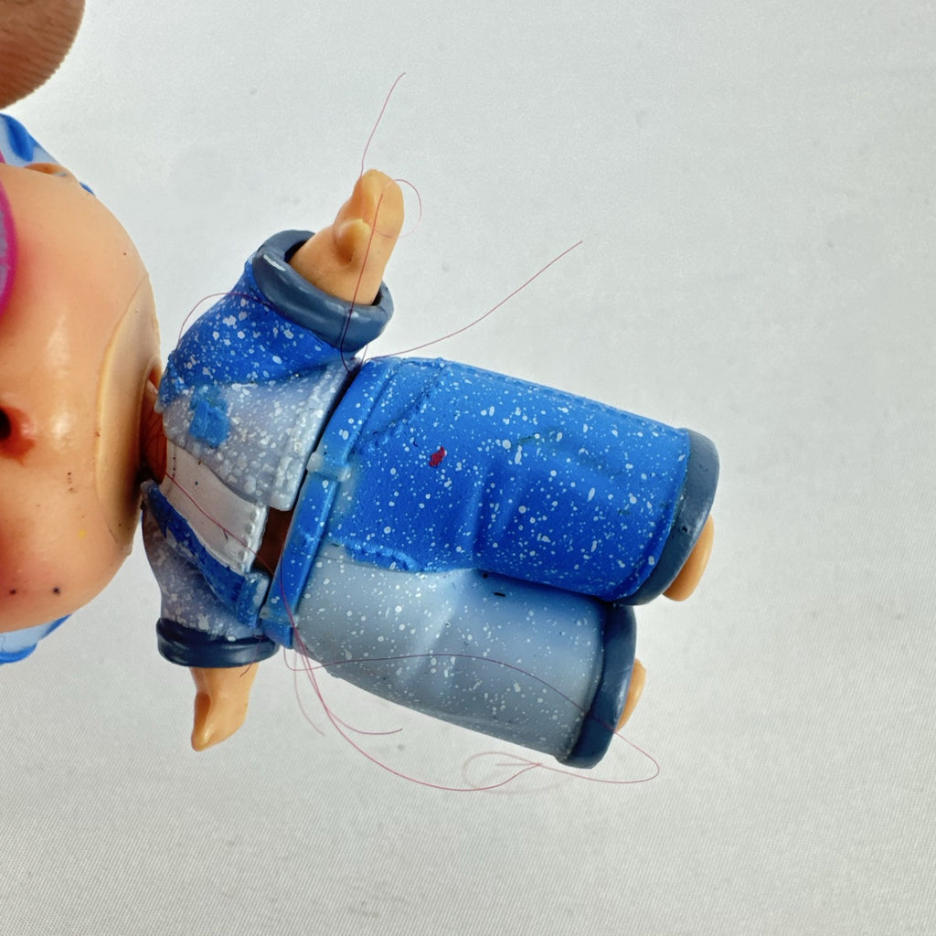MGA L.O.L. Surprise! Boys Series 1 Do-Si-Dude 3-inch doll wearing blue cowboy hat and pink sunglasses