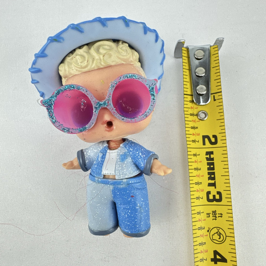 MGA L.O.L. Surprise! Boys Series 1 Do-Si-Dude 3-inch doll wearing blue cowboy hat and pink sunglasses
