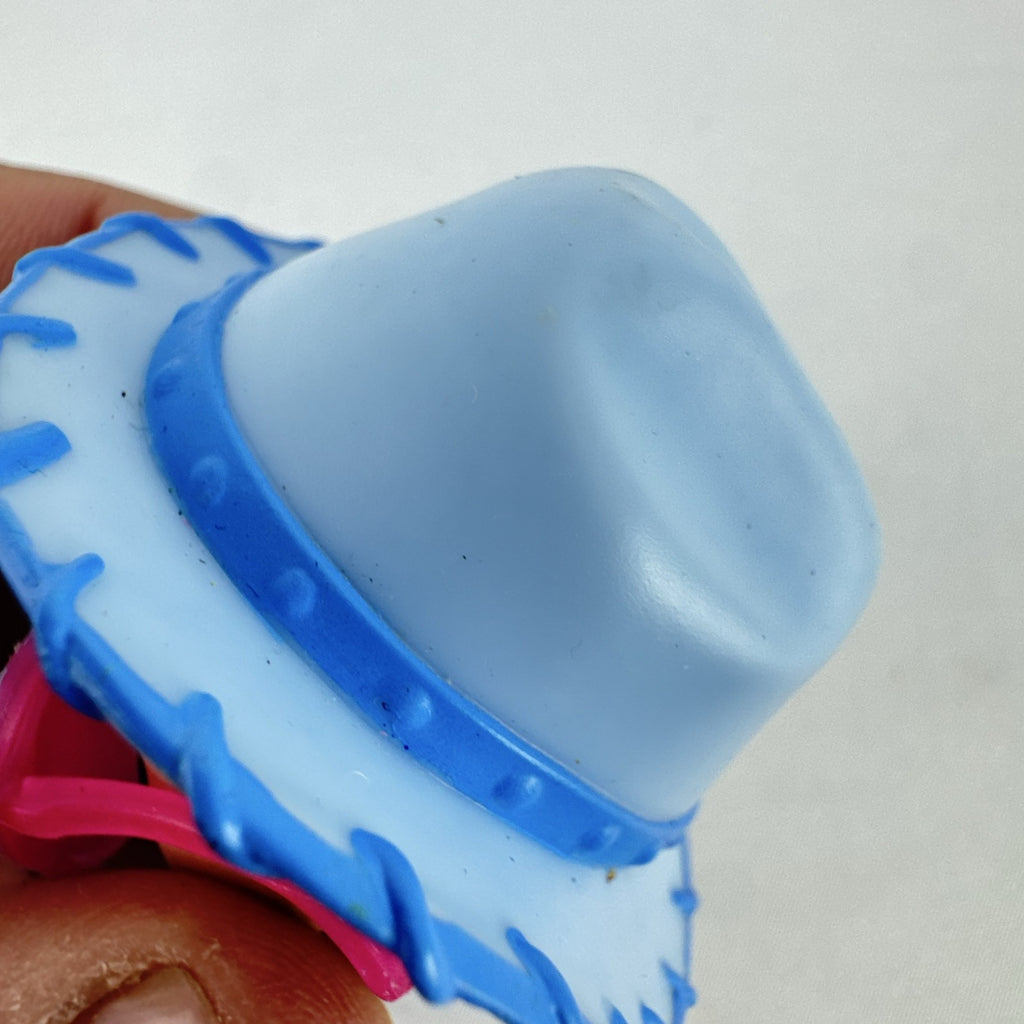 MGA L.O.L. Surprise! Boys Series 1 Do-Si-Dude 3-inch doll wearing blue cowboy hat and pink sunglasses