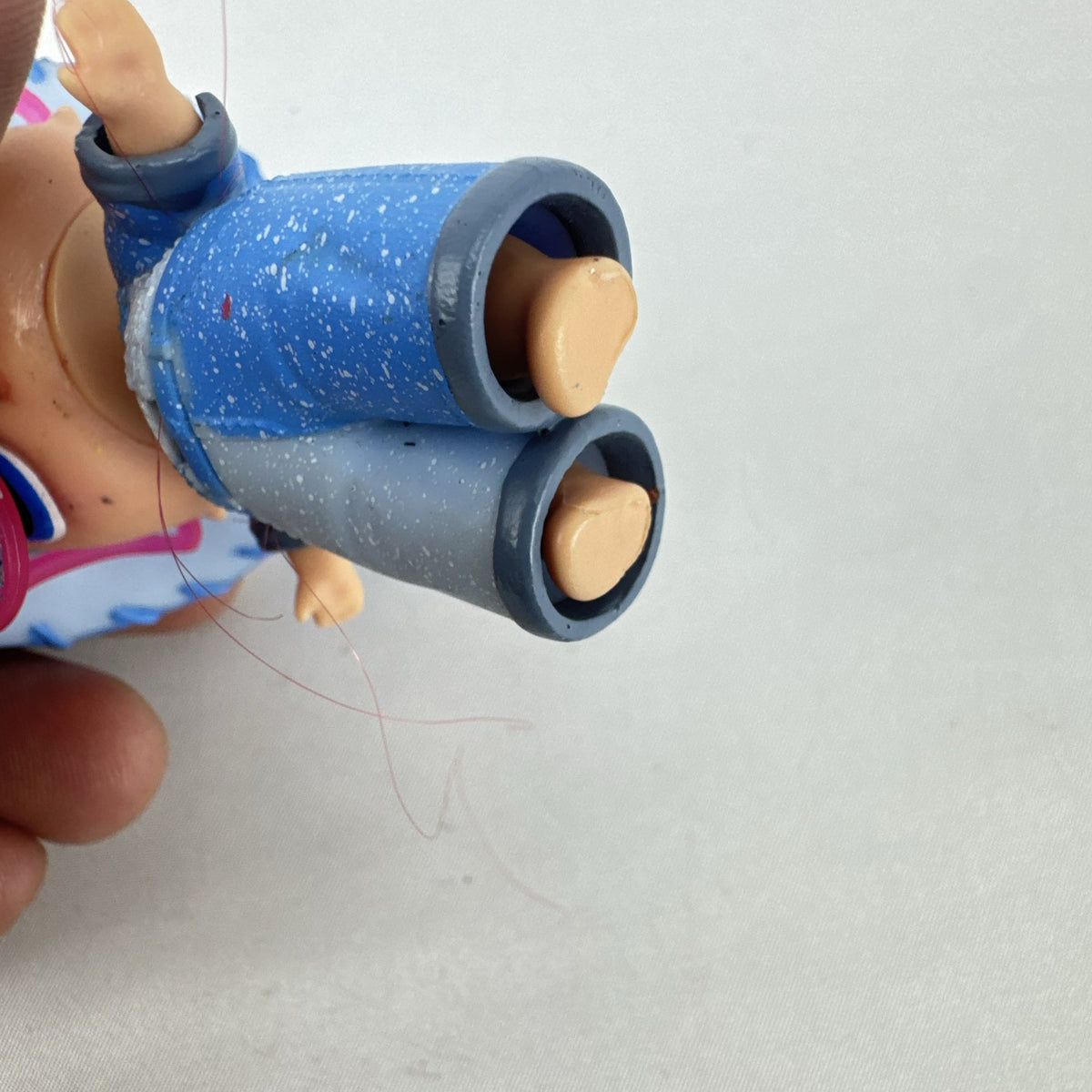 MGA L.O.L. Surprise! Boys Series 1 Do-Si-Dude 3-inch doll wearing blue cowboy hat and pink sunglasses
