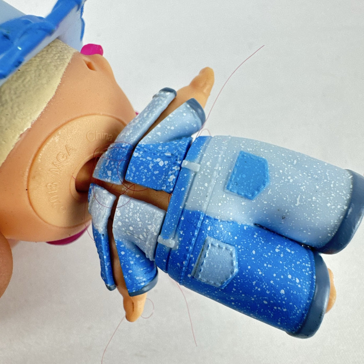 MGA L.O.L. Surprise! Boys Series 1 Do-Si-Dude 3-inch doll wearing blue cowboy hat and pink sunglasses