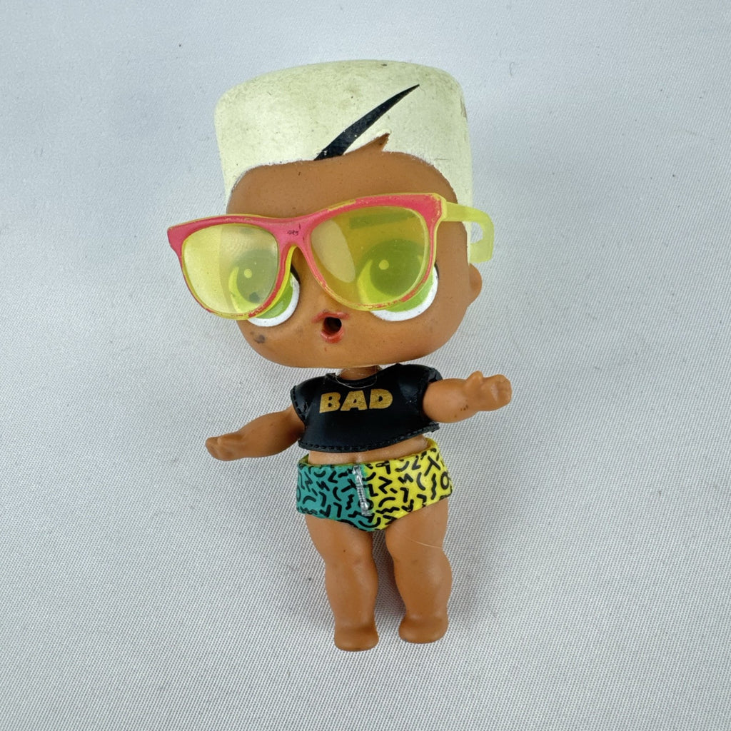 MGA Entertainment L.O.L. Surprise! 3-inch mini doll with blonde flat-top hair, sunglasses, and BAD crop top