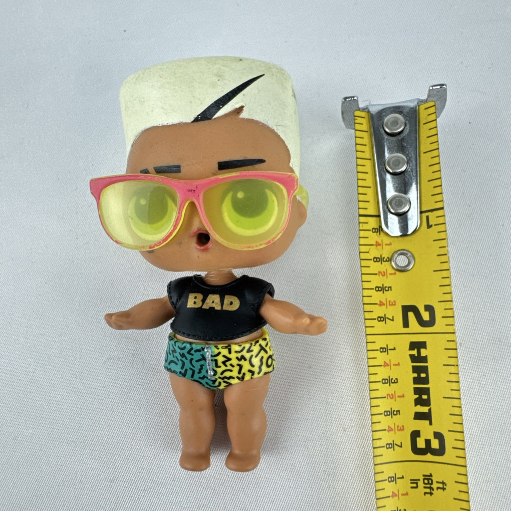 MGA Entertainment L.O.L. Surprise! 3-inch mini doll with blonde flat-top hair, sunglasses, and BAD crop top