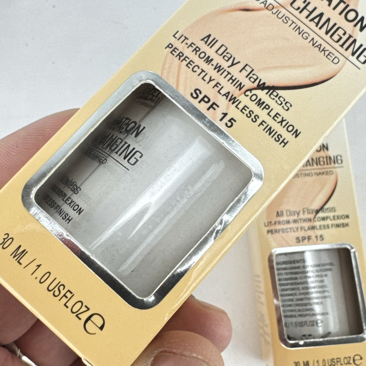 Two bottles of TLM Color Changing Liquid Foundation with SPF 15 in original packaging
