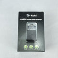Gray Kaito KA200 pocket AM FM radio with analog dial and headphone jack in original packaging