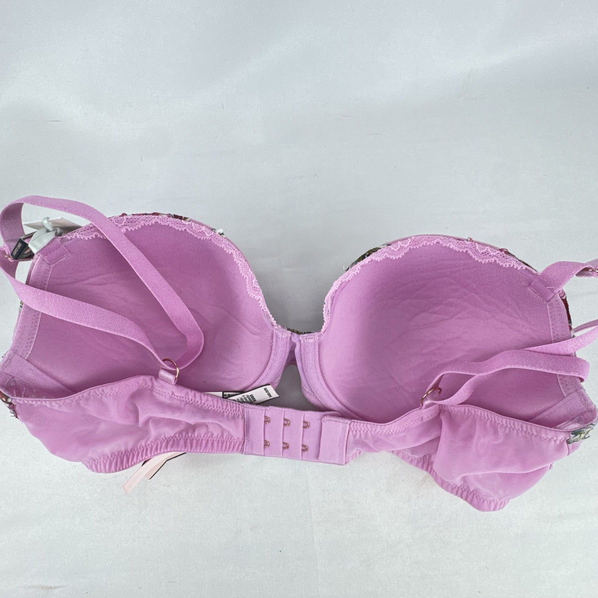 Victoria's Secret size 34D pink mesh lightly lined underwire bra with multicolor floral embroidery.