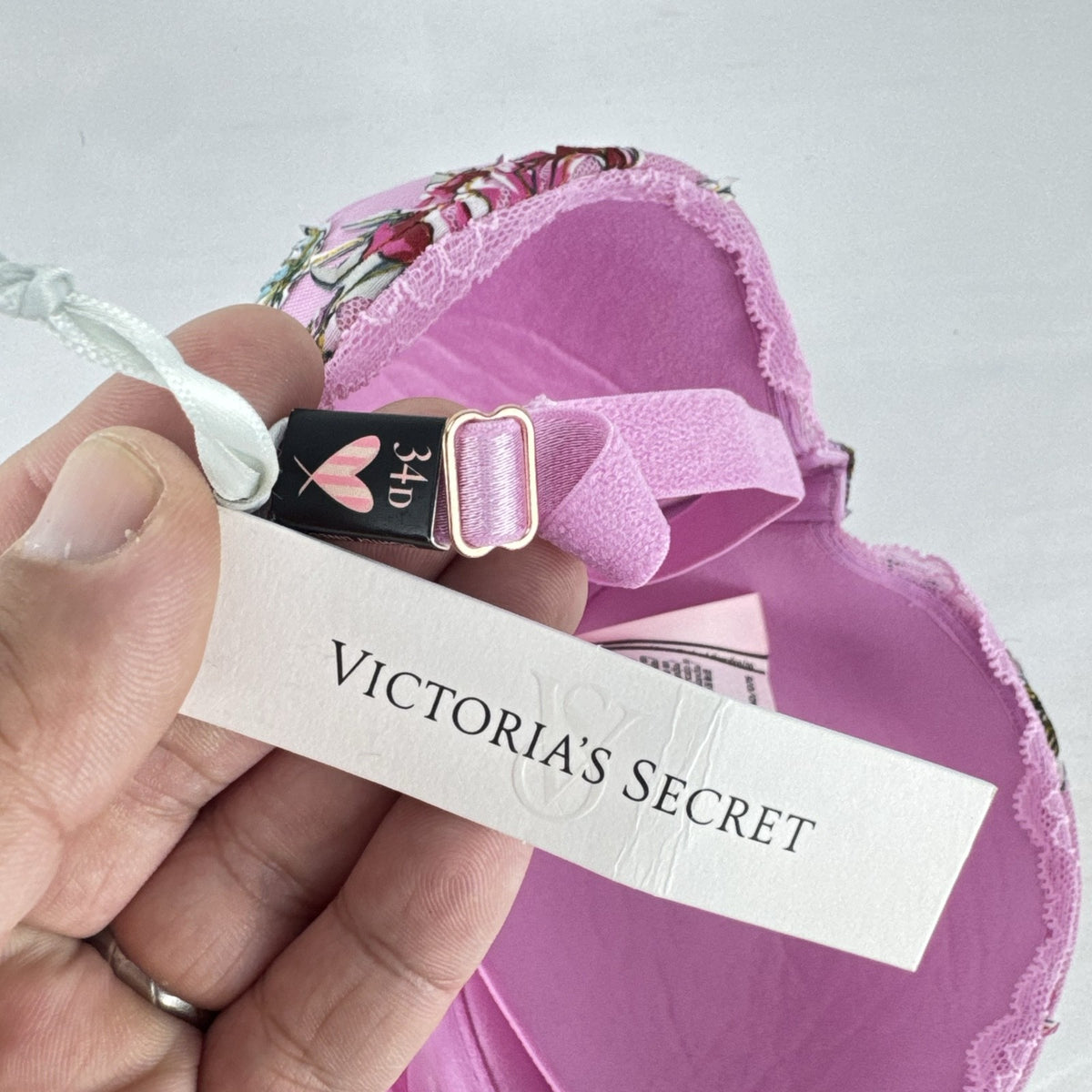 Victoria's Secret size 34D pink mesh lightly lined underwire bra with multicolor floral embroidery.