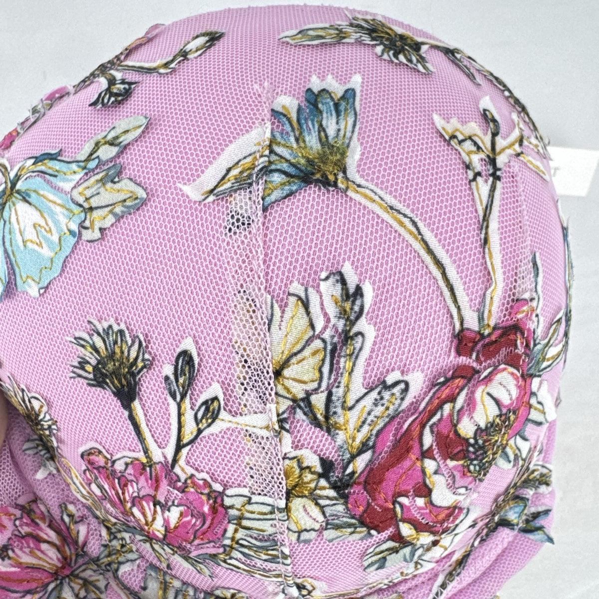Victoria's Secret size 34D pink mesh lightly lined underwire bra with multicolor floral embroidery.