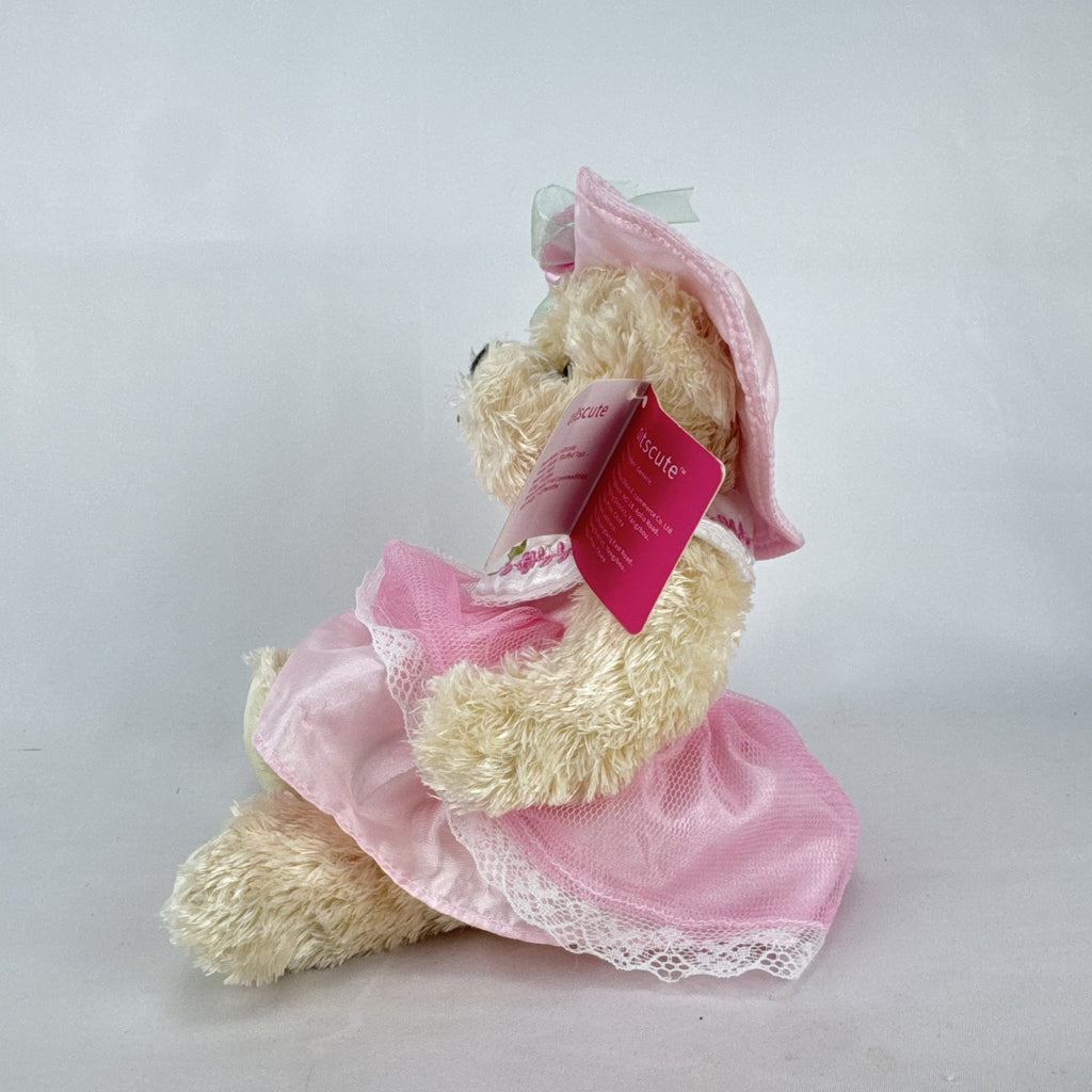 Oitscute 9-inch beige plush teddy bear wearing a pink lace dress and bonnet while holding a mini white bunny