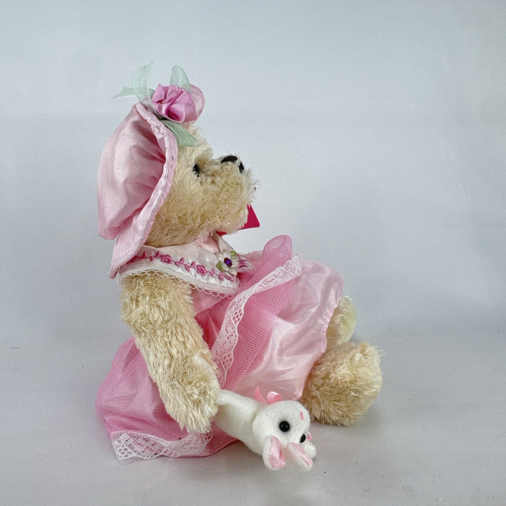 Oitscute 9-inch beige plush teddy bear wearing a pink lace dress and bonnet while holding a mini white bunny
