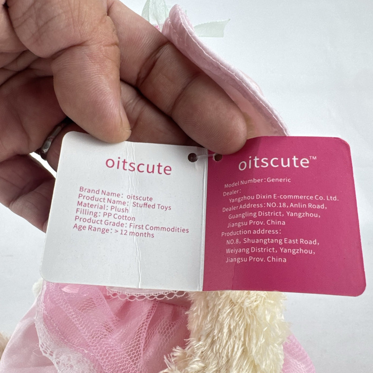 Oitscute 9-inch beige plush teddy bear wearing a pink lace dress and bonnet while holding a mini white bunny