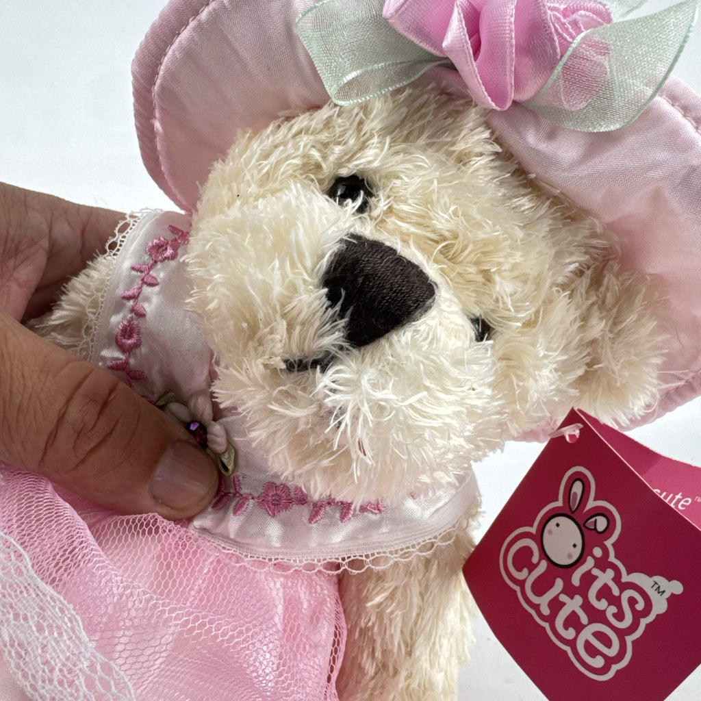 Oitscute 9-inch beige plush teddy bear wearing a pink lace dress and bonnet while holding a mini white bunny