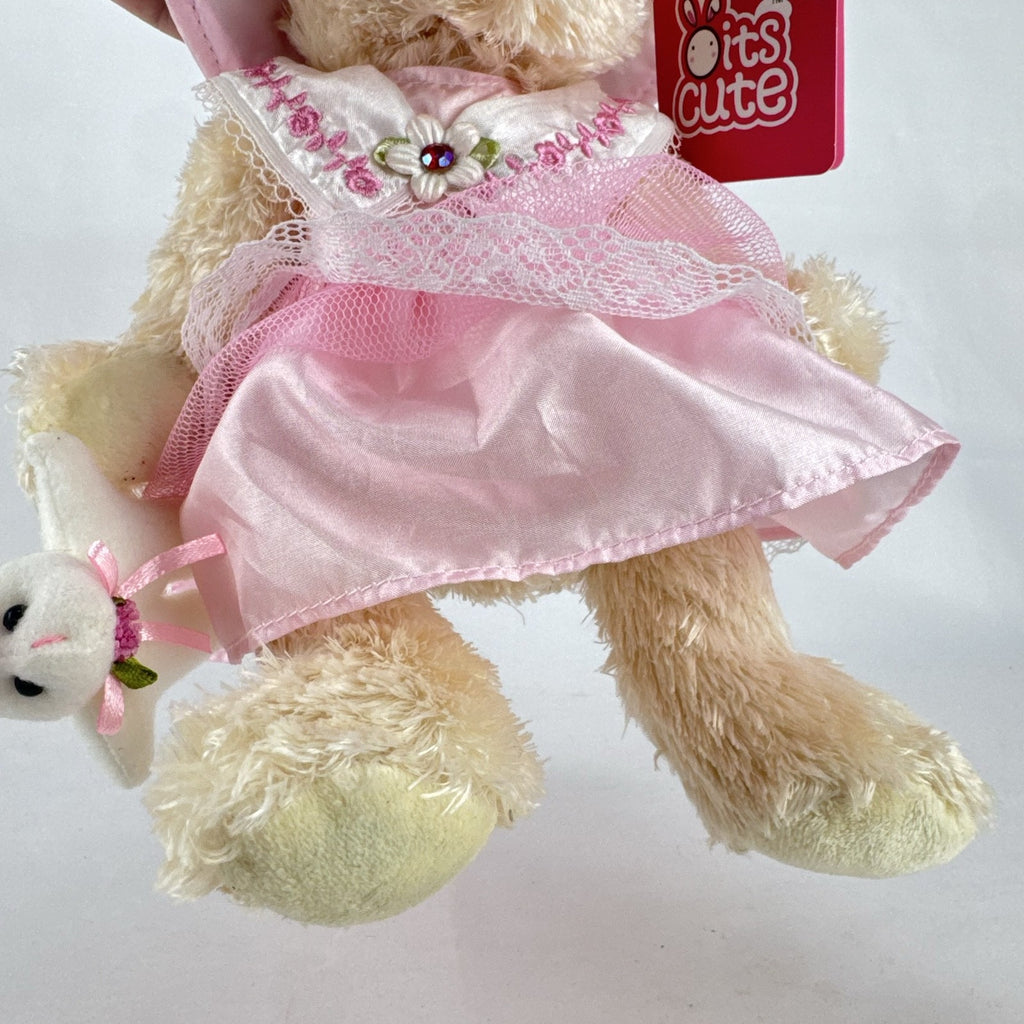 Oitscute 9-inch beige plush teddy bear wearing a pink lace dress and bonnet while holding a mini white bunny