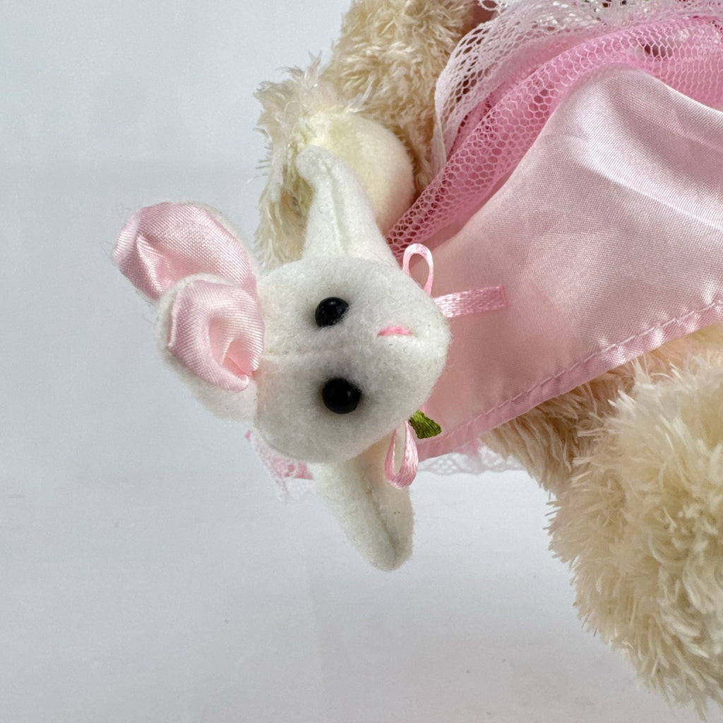 Oitscute 9-inch beige plush teddy bear wearing a pink lace dress and bonnet while holding a mini white bunny