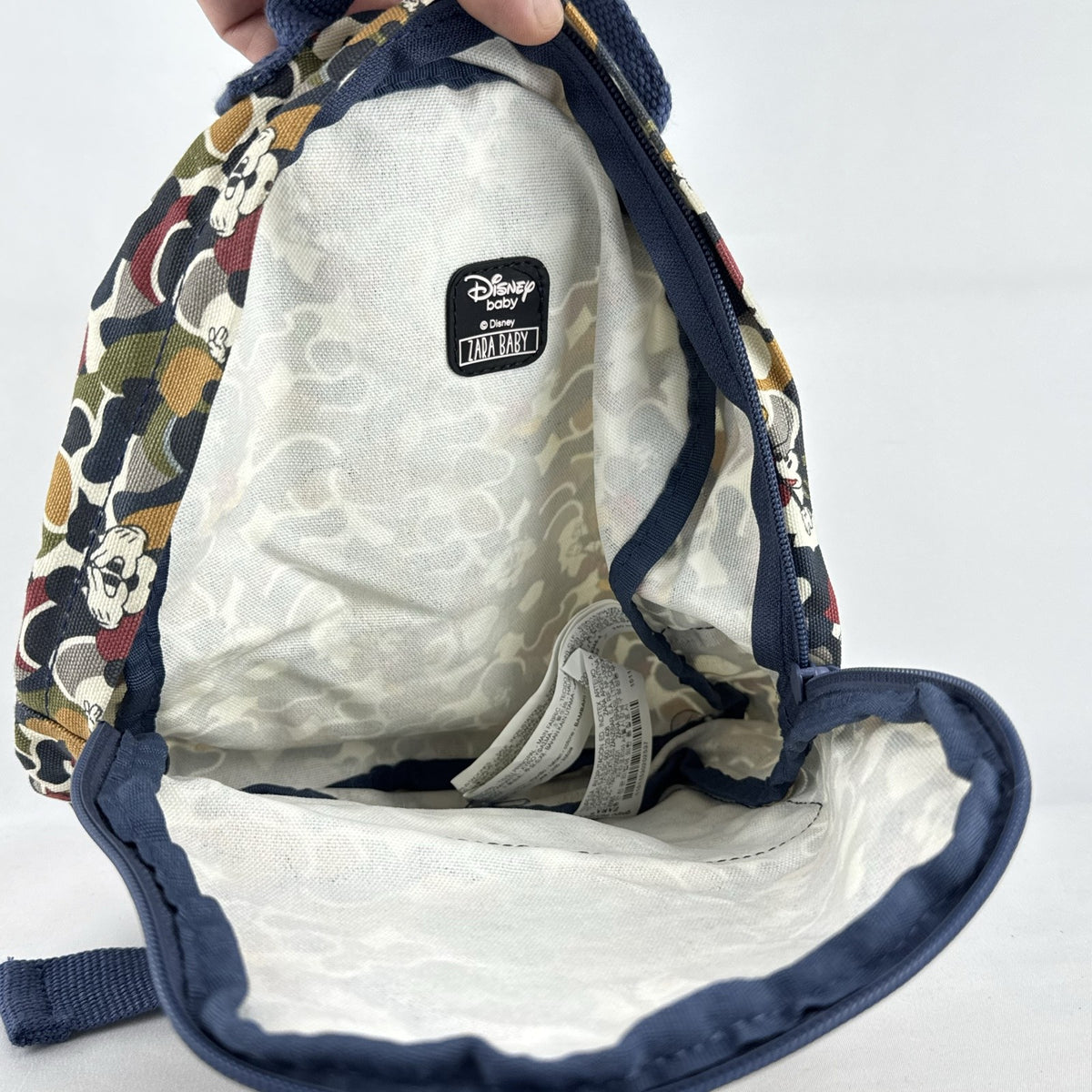 Zara Disney Mickey Mouse mini backpack in multicolor camouflage canvas with front rubber graphic