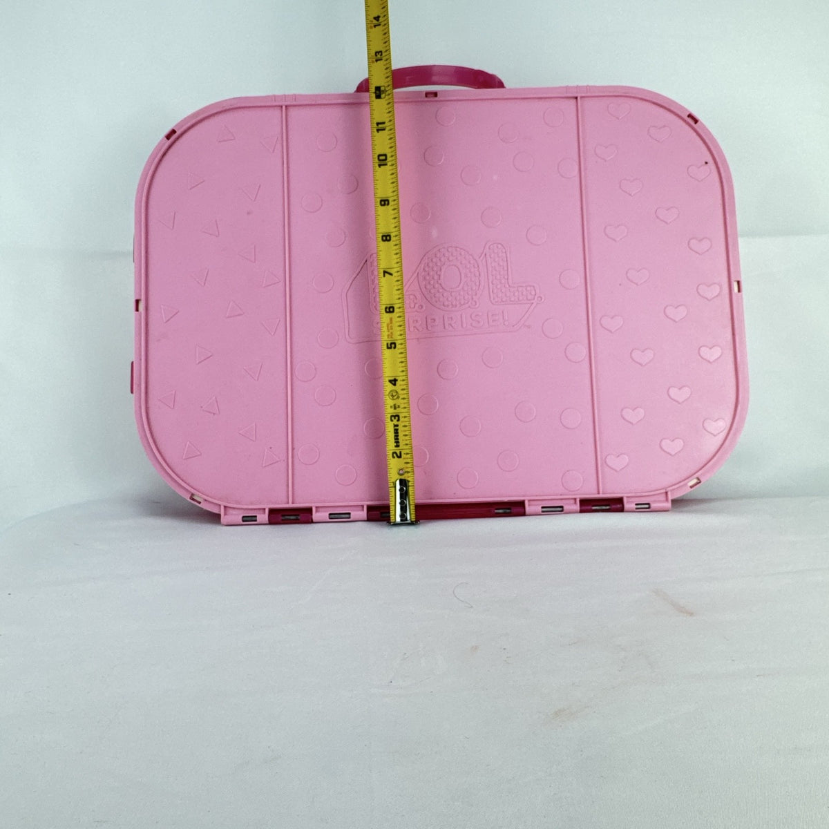 MGA Entertainment L.O.L. Surprise! pink doll carrying case and runway display stand